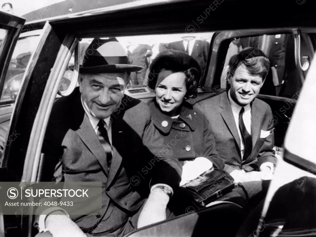 President Lyndon Johnson campaigns in New York City with Robert Kennedy. The former Attorney General was campaigning for the US Senate. With them in the Presidential limousine is Kennedy's wife Ethel. Oct. 14, 1964.
