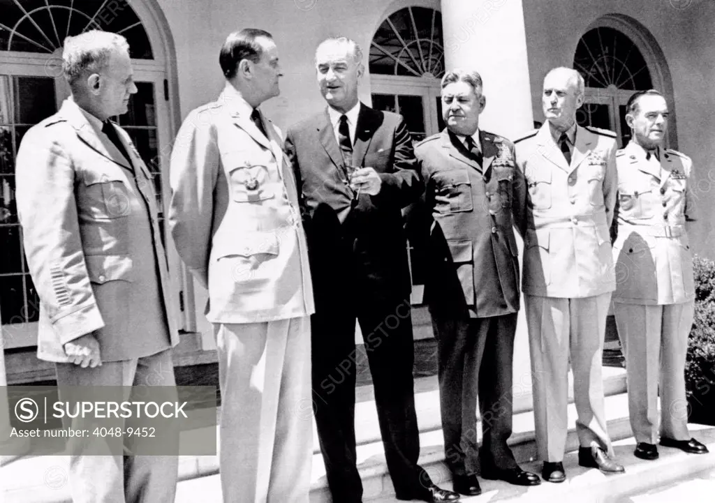 President Lyndon Johnson with the Joint Chiefs of Staff at the White House. L-R: Gen. Harold Johnson, Army Chief, Gen. Earle Wheeler, Chmn. Joint Chiefs, LBJ, Gen. Curtis LeMay, Air Force, Adm. David McDonald, chief of Naval Operations, and Lt. Gen. Wallace Greene, Marine Corps. July 31, 1964.