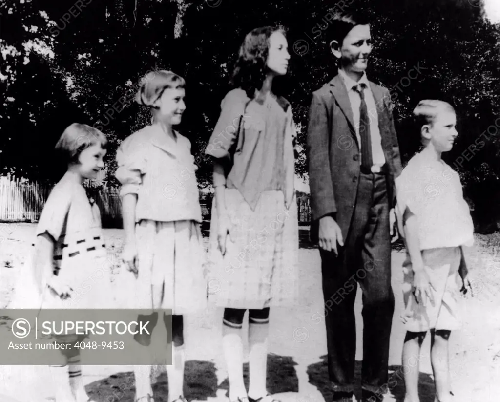 President Lyndon Johnson in an old family photo with his siblings. L-R: Lucia, Joseph, Rebekah, Lyndon in his first long pants, and Sam. Stonewall. Texas. 1921.