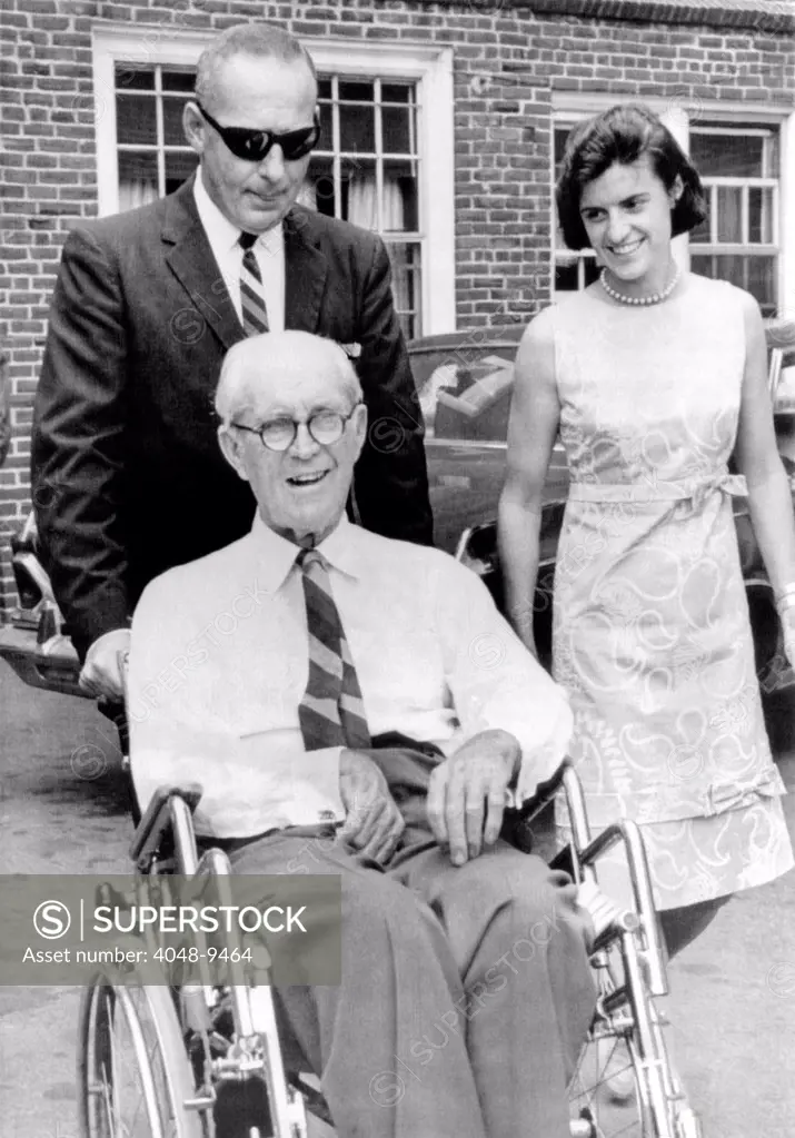 Joseph P. Kennedy on Aug. 31, 1964. Kennedy family patriarch visited his son Sen. Edward Kennedy who is recovering from a broken back suffered in a plane crash in June. With Kennedy are Frank Saunders (left) and his niece, Ann Gargan. Aug. 31, 1964.