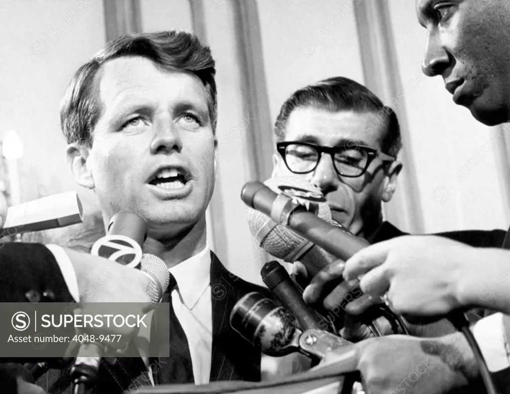 Senator Robert Kennedy in a press conference. He responded to an announcement that 12,000 workers would be affected by the closing of the Brooklyn Navy Yard and the Army Terminal. Nov. 19, 1964.