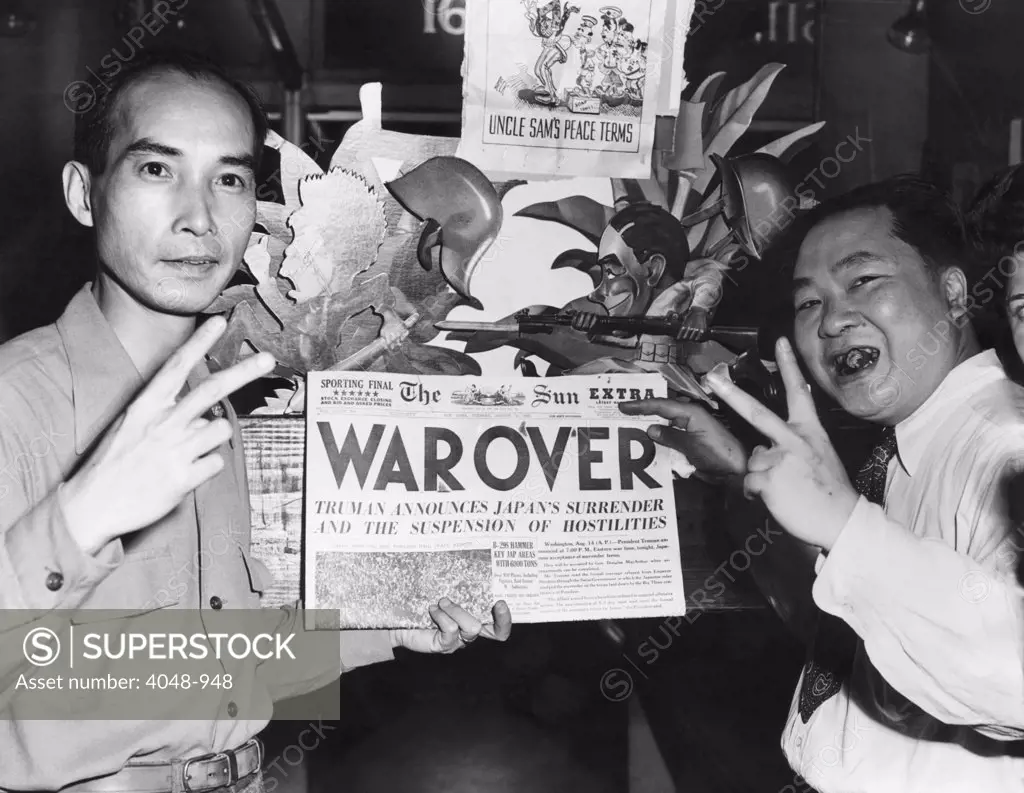 Two Chinese-Americans celebrating the announcement of the end of World War II, New York, 1945.