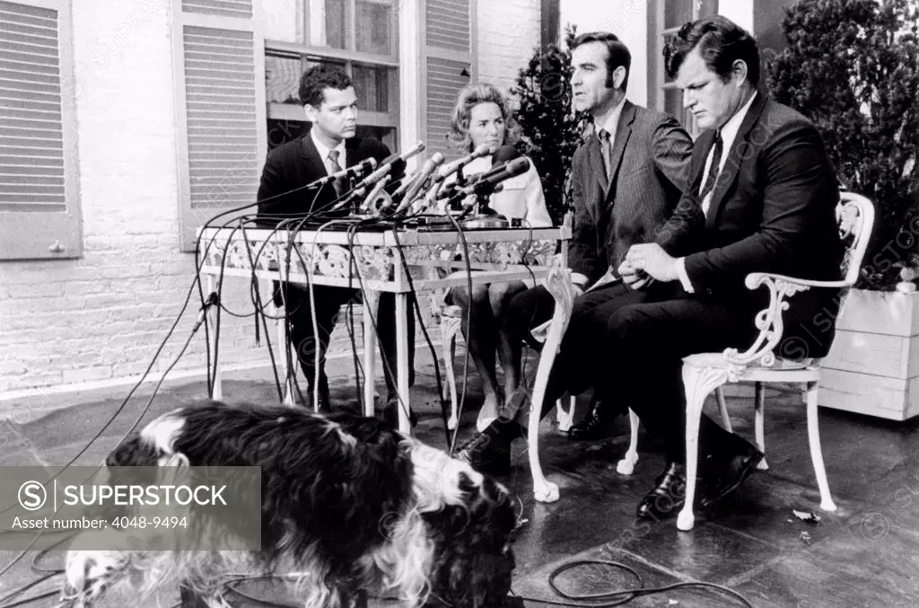 Kennedy family announces the Robert F. Kennedy Memorial Fellowship program. L-R: Julian Bond, B. J. Stiles, second from right, director of the Fellowship program, Ethel Kennedy, Sen. Edward Kennedy. The Kennedy dog 'Freckles' wanders by during the press conference. June 23, 1969.