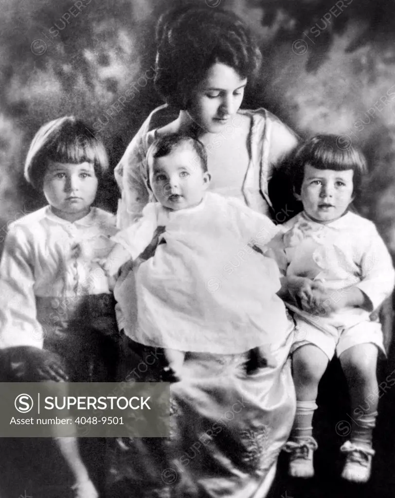 Rose Kennedy with her three eldest children. Joseph Jr. (left), Rosemary (center), and John. Ca. 1919.