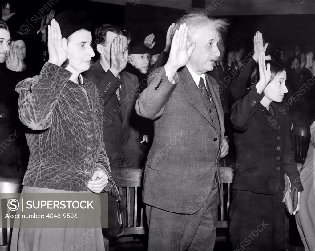 Albert Einstein taking his oath of citizenship. Also taking swearing allegiance in are Helen Dukas, and Einstein's daughter, Margot. Oct. 1, 1940.
