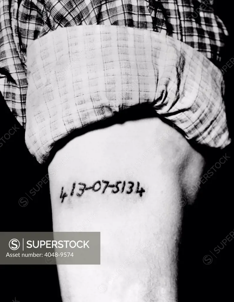Social Security number tattooed onto an arm. Jeon Reese Roofener, a Memphis engineer, figures it to be a good identification mark. 'In case, I go crazy and get amnesia or somp'n like.' Jan. 14, 1937.