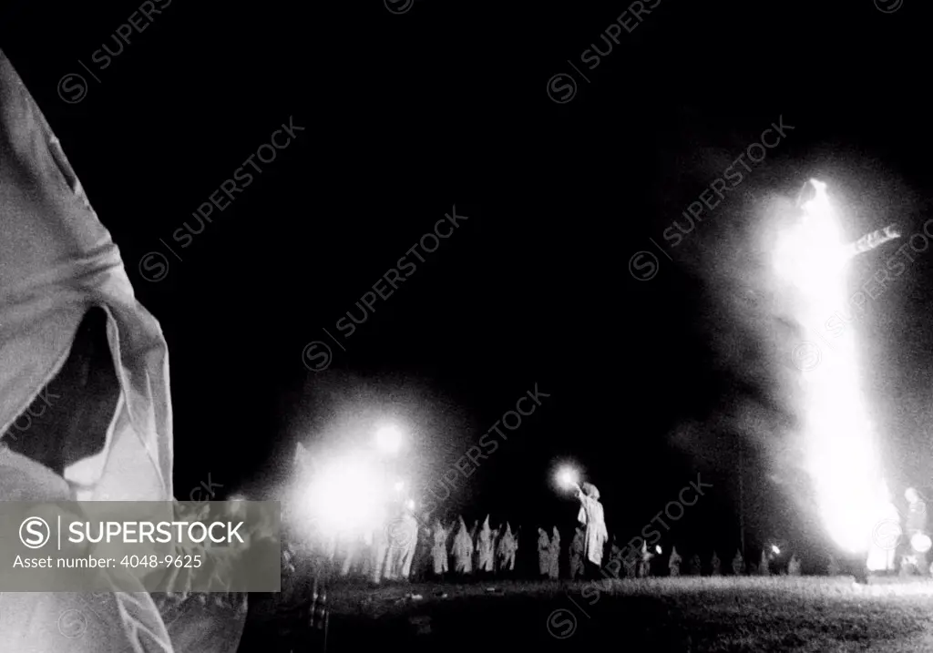 Ku Klux Klan cross burning at Stone Mountain, Georgia. Hundreds, many masked, in a rally to celebrate the founding of the hooded order nearly 100 years ago. Sept. 3, 1966.