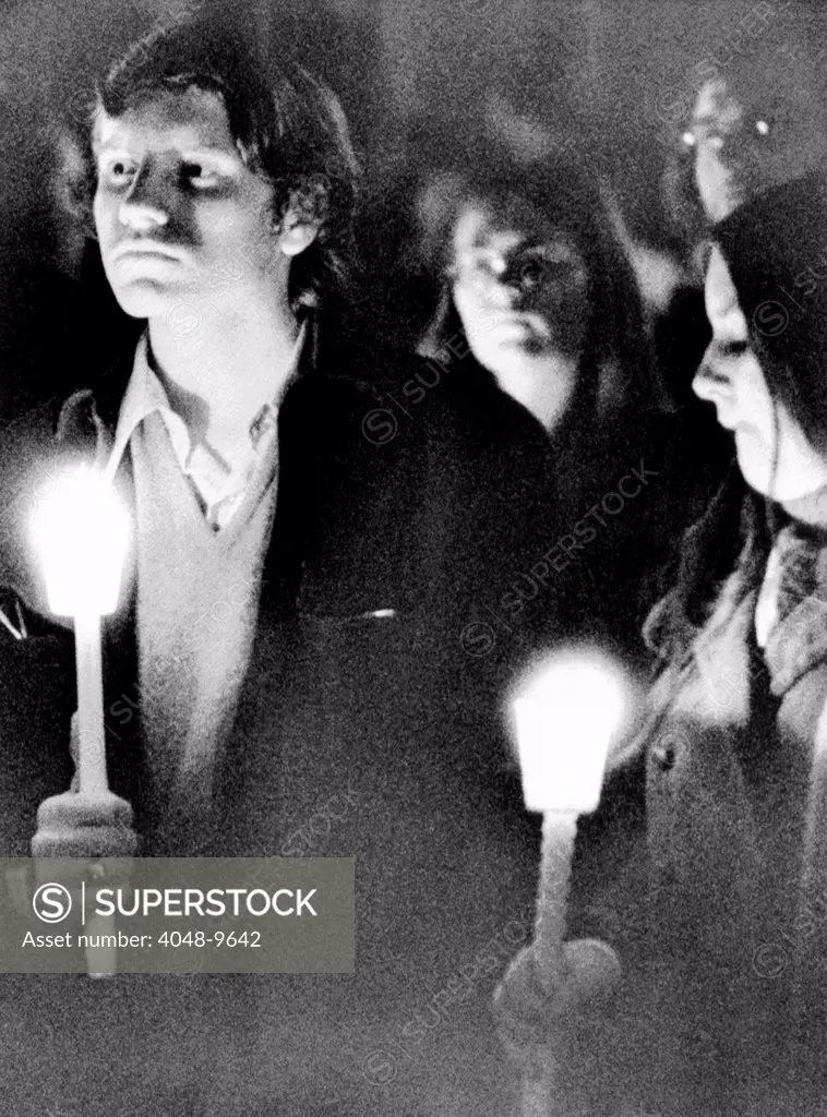 Kent State University students hold candles during a silent vigil. They observe the first anniversary of the May 4, 1970 killing of 4 students by Ohio National Guards troops.