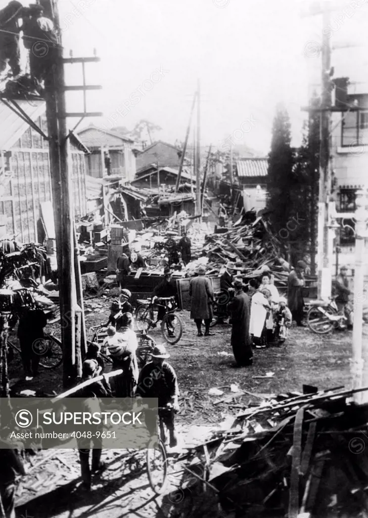 Earthquake destruction on a street in Mishawa, Japan. 250 were killed, thousands rendered homeless and many villages in the southern portion of Japan were leveled. Nov. 25, 1930.