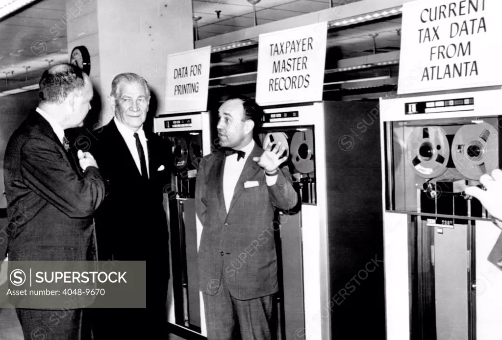Treasury Secretary Douglas Dillon dedicated the National Computer Center on Nov. 6, 1961. The core of the center is the new automatic data processing system of the Internal Revenue Service. By 1966, it will review the tax return of every American. L-R: Dillon, Sen. Willis Robertson, and Mortimer Caplin, Commissioner of Internal Revenue.