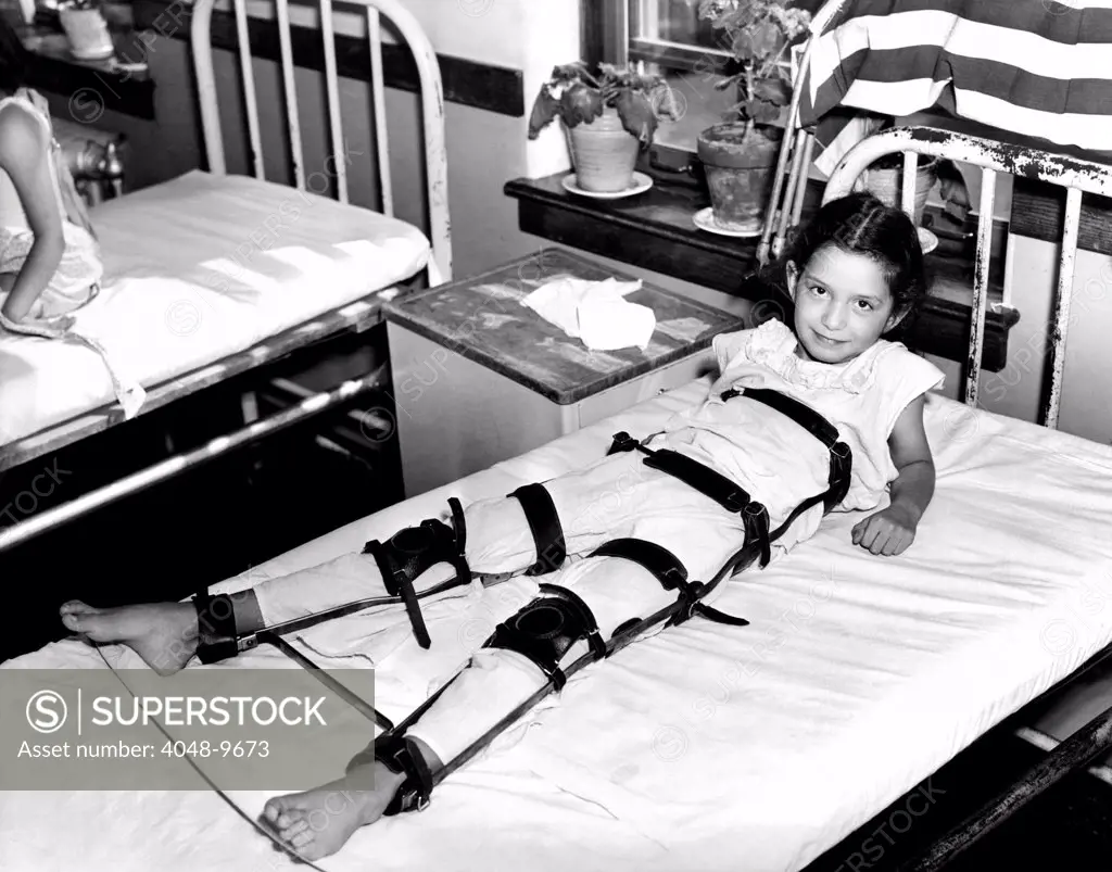 Young Polio victim in bed with a body and leg brace. Sept. 18, 1937.
