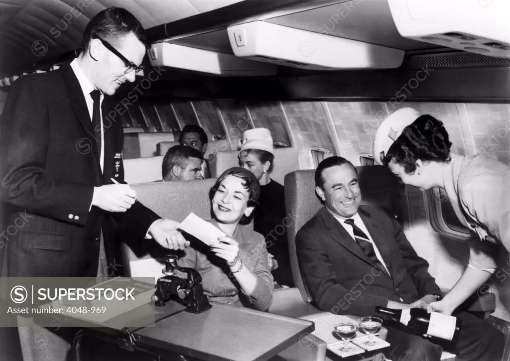 Continental Airlines has transferred all ground ticketing funcitons to the company's Golden Jet Boeing 707s. A director--passenger services, a post created especially for the jets, picks up tickets, collects fares from those without tickets and charges for excess baggage.  1961.