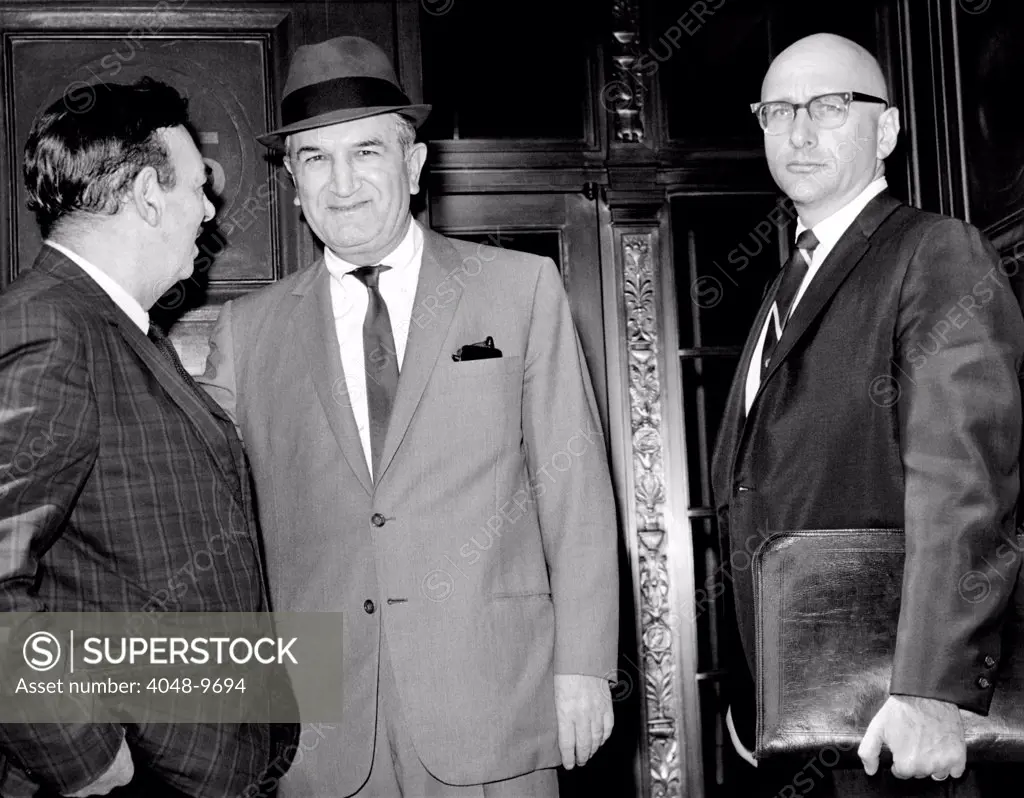 Joseph (Joe Bananas) Bonanno (center) talks to UPI reporter Robert Evans on steps of Federal Courthouse. Bonanno is accompanied by his attorney, Albert J. Krieger. May 17, 1966.