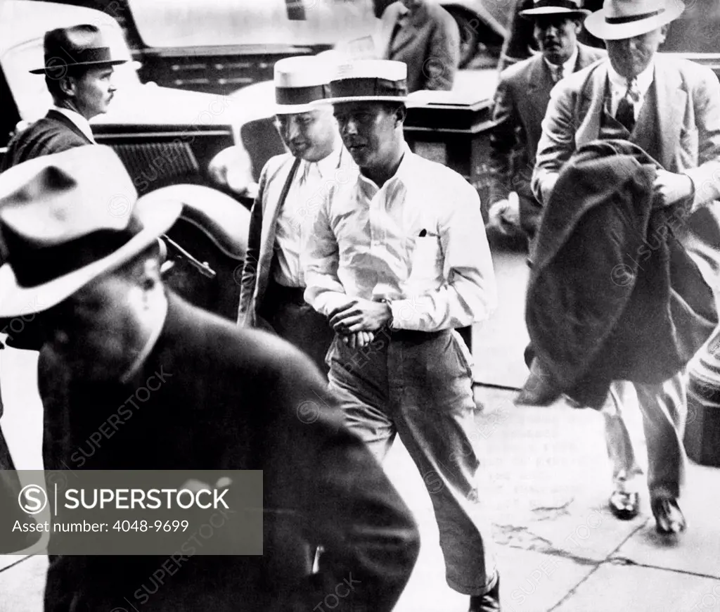 Alvin Karpis, 'Public Enemy No. 1', walks behind his captor, J. Edgar Hoover, director of the FBI, (at left) into Federal Court in St. Paul, Minn. May 03, 1936.