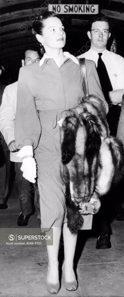 Virginia Hill arriving at New York Airport on August 8, 1947, a month after Bugsy Seigel was killed. She did not rush back from France after his murder. She was an American organized crime figure in her own right. Before meeting Bugsy Seigel, she worked for Joseph Epstein, of Chicago in his bookmaking ring, as a courier, and money launderer.