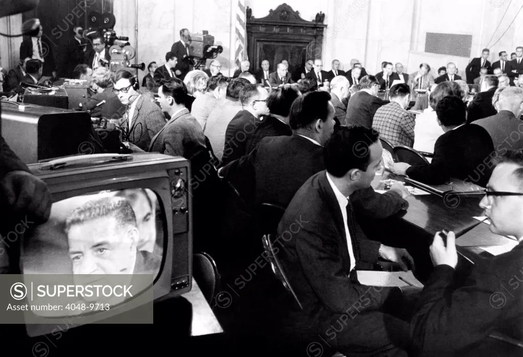 Senate Caucus Room during Joseph Valachi's testimony. Valachi is seen on the TV monitor and members of the Committee are shown in the background. Valachi agreed to testify on the workings of the underworld crime empire, 'Cosa Nostra'. Sept.27. 1963.