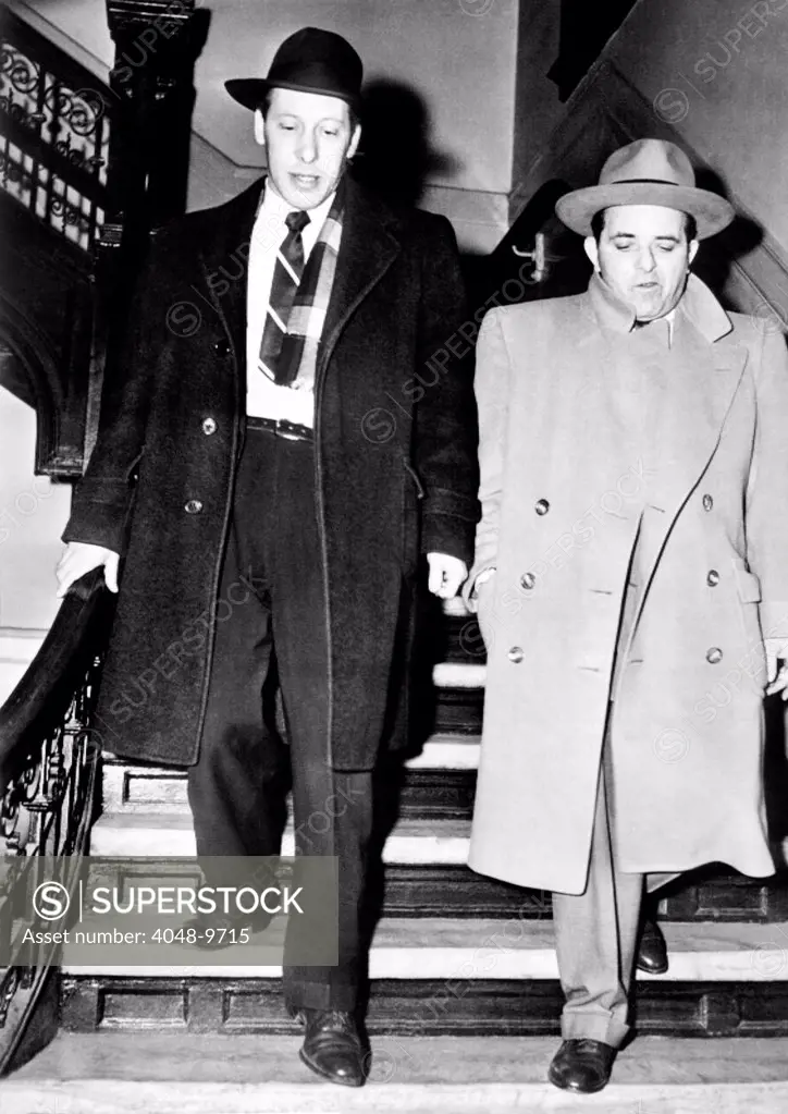 Anthony Anastasia (right) after his arrest by immigration authorities on charges of entering the country illegally. The brother of Albert Anastasia, reputed former executioner of Murder Inc., jumped ship with his brothers, Albert, Gerardo and Salvatore in 1919. March 27, 1951.