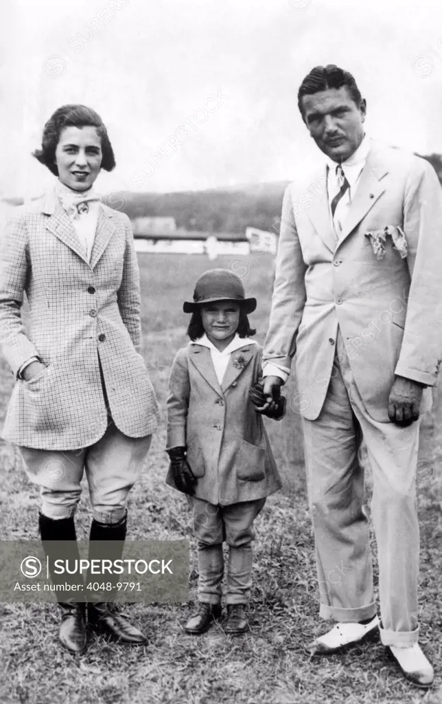 Jacqueline Kennedy, with her parents, Janet and John V. Bouvier. They are at the Annual Horse Show of the Riding and Hunt Club of Southampton during the summer of 1934.