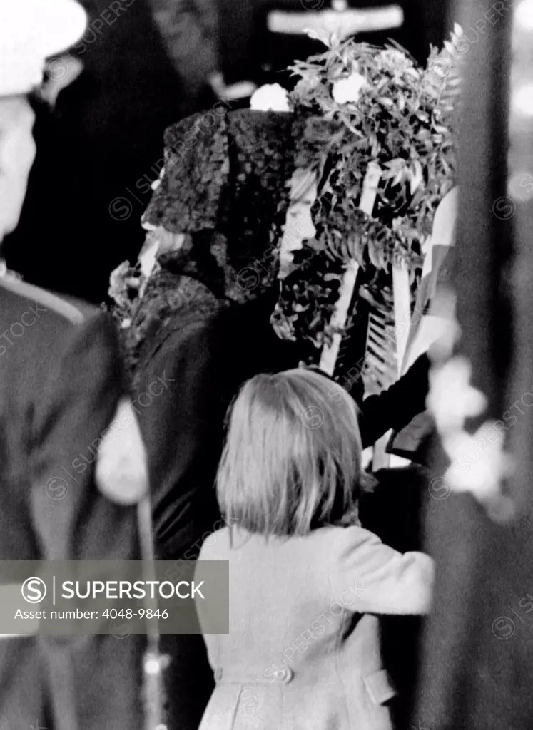 President John Kennedy's lying in State ceremonies. Jacqueline and Caroline Kennedy at the late President's coffin in the Capitol Rotunda. Nov. 24, 1963.