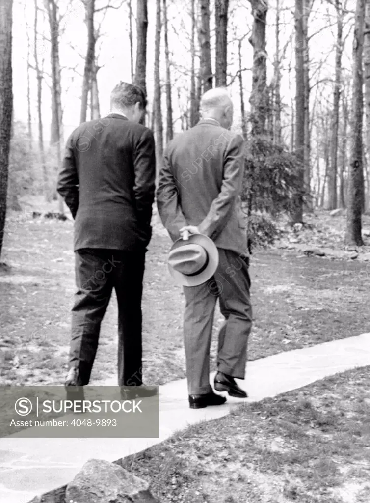 Presidents Dwight Eisenhower and John Kennedy meet after the failed Bay of Pigs invasion. Camp David, Maryland. April 22, 1961.