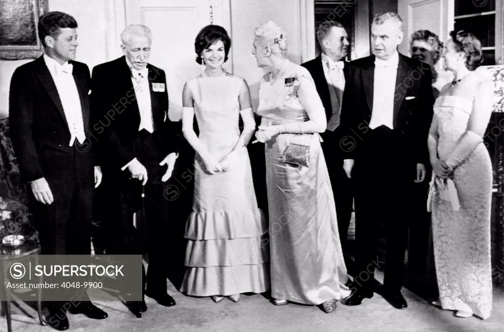 President John Kennedy visiting Canada. The Kennedy's gave his Canadian hosts a dinner at the US Embassy. (L-R) President Kennedy, Gov. Gen. George Vanier, Jacqueline Kennedy, Mrs. George Vanier, Ambassador Livingston Merchant, Prime Minister John Diefenbaker, Mrs. Merchant, and Mrs. Diefenbaker. May 17, 1963.