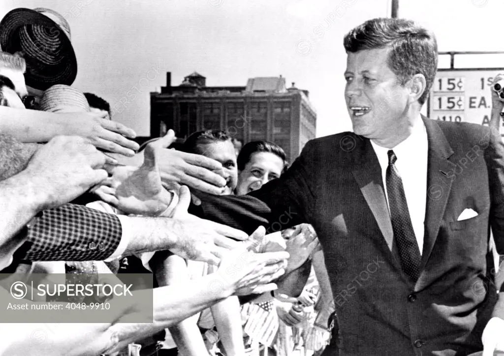 President John Kennedy shakes hands as he arrives to give a speech at Independence Hall. July 4, 1962.