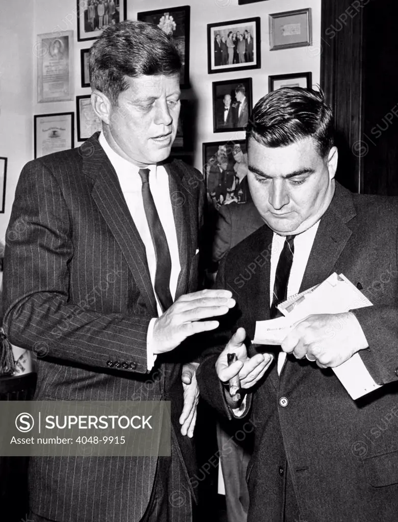 President-elect John Kennedy confers with press secretary Pierre Salinger in his Senate office. Dec. 1, 1960.