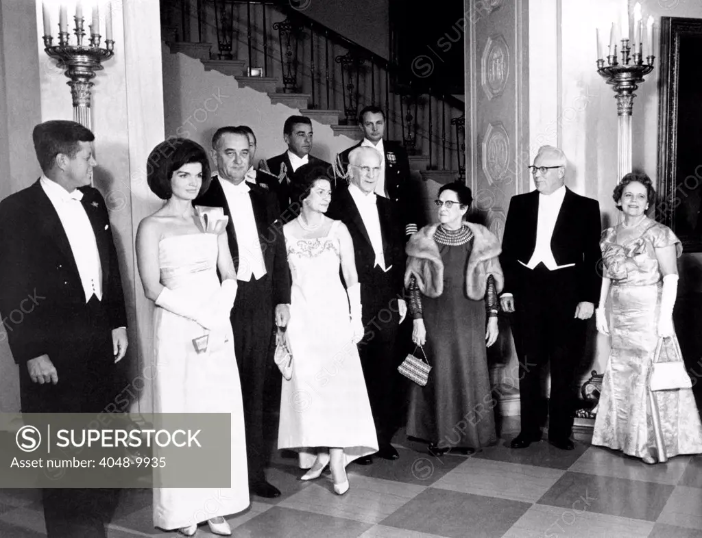 President John and Jacqueline Kennedy at a White House dinner honoring the Executive and Judicial heads of the Government. L-R: President and Mrs. Kennedy, VP and Mrs. Lyndon Johnson, House Speaker and Mrs. John McCormack, and Chief Justice and Mrs. Earl Warren. Jan 21, 1963.