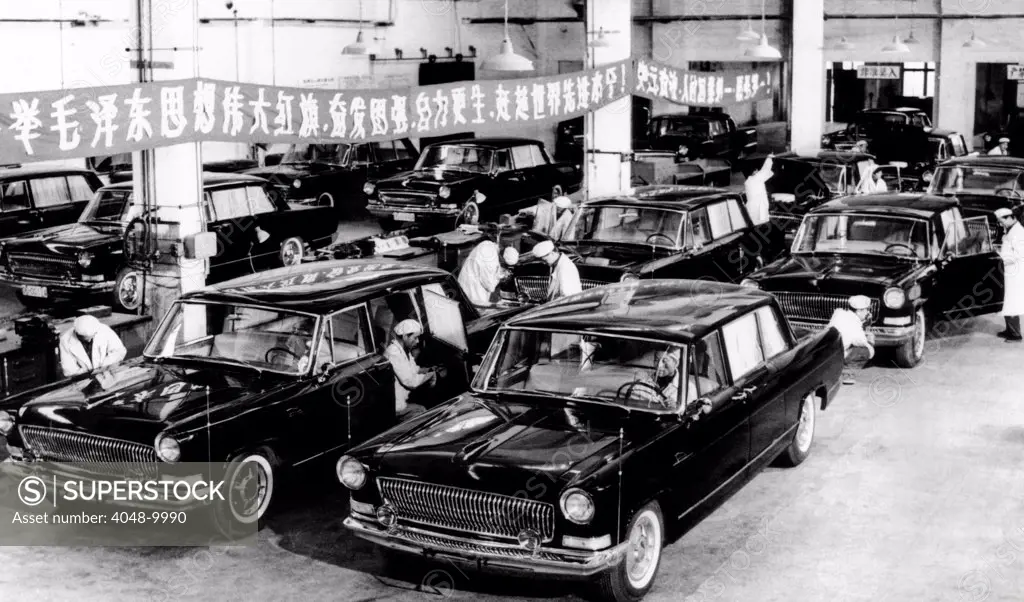 Automobiles just off the production line in Changchun, in Northeast China. Workers give a final checkup to new six passenger cars that have automatic transmissions and V-type engines. June 1966.