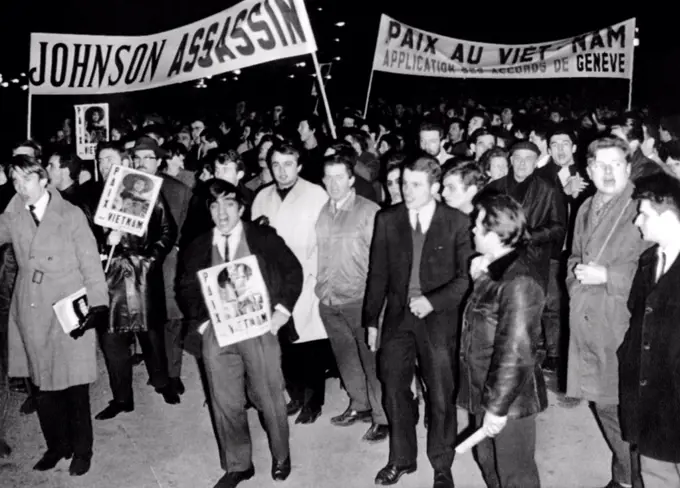 Anti-Vietnam war demonstrations in Paris. Leftist demonstrators mass in Place de la Concorde near US Embassy. Protesters carry signs reading 'Peace in Vietnam, Application of the Geneva Treaty' and 'Johnson Assassin'. Feb. 3, 1966.
