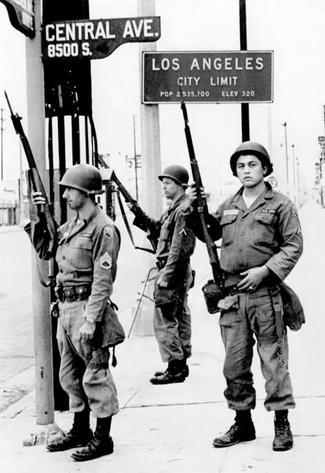 National Guardsmen at a Los Angeles City Limits. As the 1965 Watts Riots subsided, National Guardsmen still stand by until recalled by Gov. Edmund Brown. August 17, 1965.