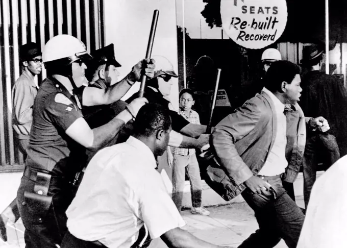 Violence on South Los Angeles street. Police attempt to clear the streets following a rash of window-breaking and rock-throwing in the African American section of the city. Oct. 19, 1967.
