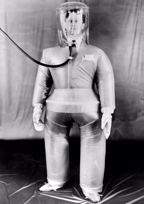 Plastic protective outfit filled with compressed air. It was designed to protect British Atomic energy workers against radioactive dust and particles. Oct. 21, 1954.