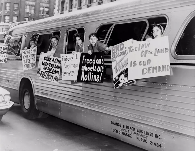 Supporting the Freedom Riders. Members of the 'Washington Freedom Riders Committee,' hang signs from bus windows to protest segregation. New York City, May 30. 1961.