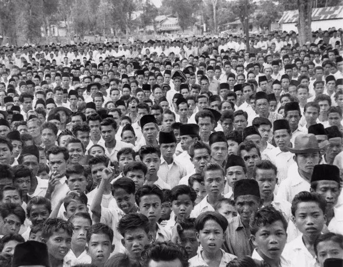 Indonesians in an  anti-Sukarno rally in Batu Sankar, Sumatra. They protested President Sukarno's consolidation of dictatorial powers. 1958.