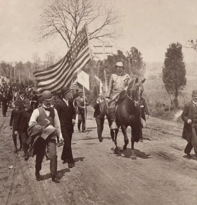 Dressed in fringed buckskin suit, 'Marshal' Carl Browne leads the Coxey Army in 1894. With Coxey, he planned the march to Capitol Hill to present their Good Roads Bill, a $500 million Federal job plan. He was eccentric, believing himself to be the reincarnation of Jesus Christ  (BSLOC_2018_2_100)