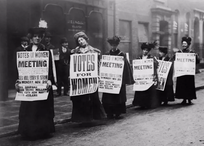 English suffragettes demonstrating in London in 1907 or 1912. One protest sign reads, 'MEETING' to demand the enfranchisement of Women and to protest against the exclusion of women from a share in law-making  (BSLOC_2018_2_52)