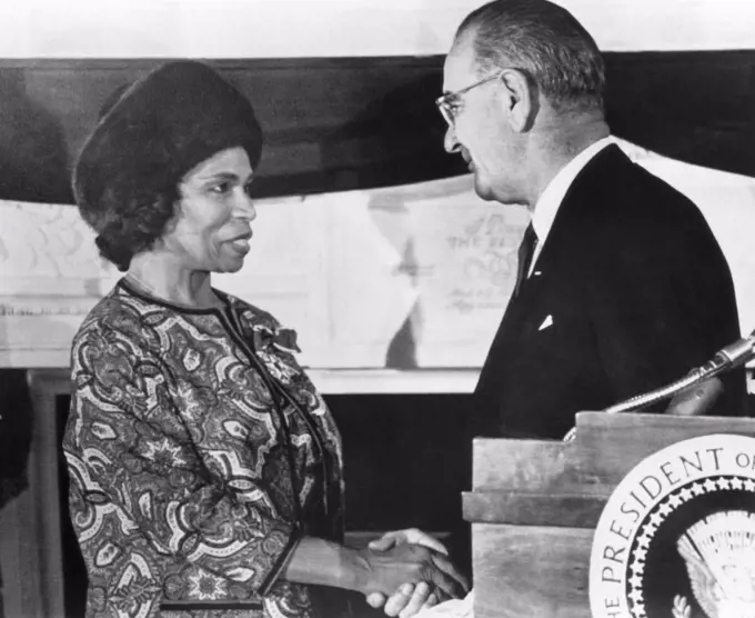 Marian Anderson is congratulated by President Lyndon B. Johnson at the White House during the presentation of the Presidential Medal of Freedom, 1965