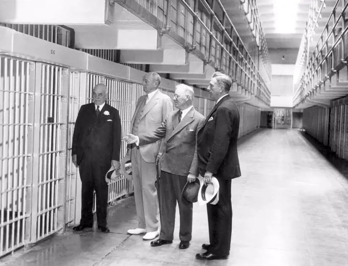 The newly built Alcatraz Federal Penitentiary receives official approval. From left: San Francisco Mayor Angelo Rossi, Attorney General Homer S. Cummings, Warden James A. Johnston, Police Chief William J. Quinn, San Francisco, August 20, 1934