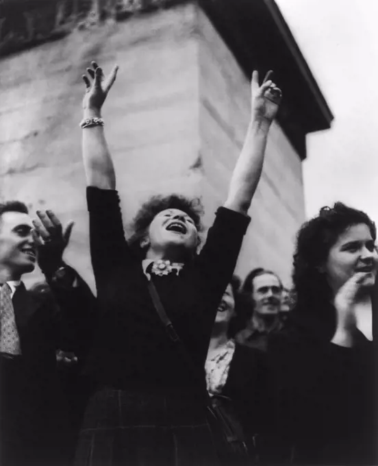 Parisian woman cheers at liberation celebration. August 29, 1944. World War 2. (BSLOC_2014_10_262)