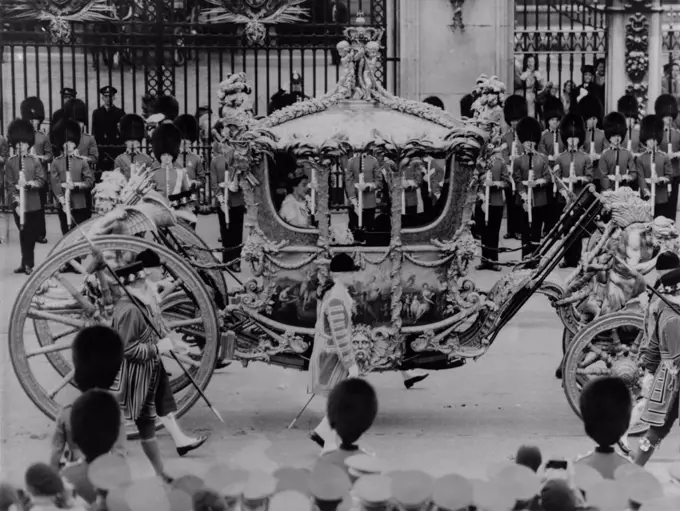 Queen Elizabeth II riding in the Gold State Coach enroute to her coronation. June 6, 1953. - (BSLOC_2014_15_259)