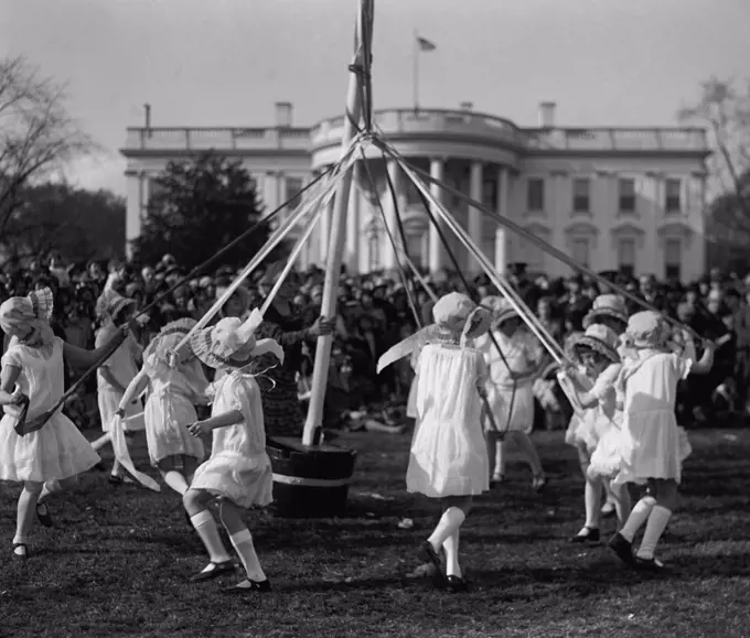 Children dance around a maypole at the White House Easter Celebration on April 1, 1929. First Lady Lou Hoover replaced the Easter Egg Roll with Folk Dancing, because she disliked egg stench that followed. (BSLOC_2015_16_88)
