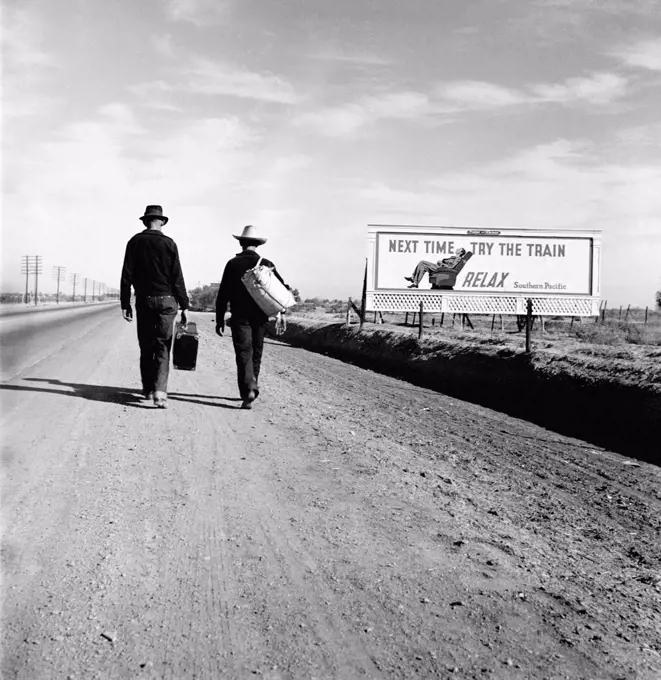 Toward Los Angeles, California, billboard reads: 'Next time try the train Relax Southern Pacific', by Dorothea Lange, for the Farm Securities Administration, March 1937.