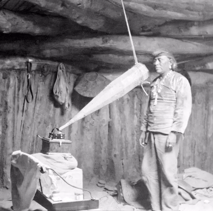 Native American having his voice recorded. Original caption reads: 'Miguelito, a Navajo from the Southwest, making a voice recording', February 19,  1914.