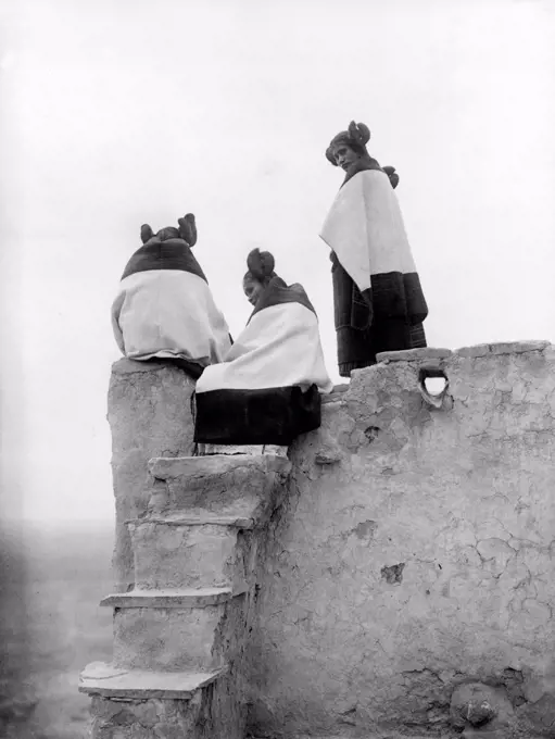 Native Americans, three Hopi women at the top of adobe steps, photograph by Edward S. Curtis, circa 1906.