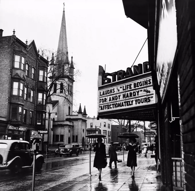 Main Street. The marquee of the Strand theater, showing LIFE BEGINS FOR HARDY, Amsterdam, New York, photograph by John Collier, October, 1941.
