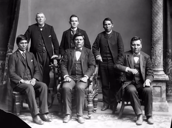Nez Perce delegates with Benjamin Beveridge (left, standing), owner of Washington House, Washington, DC. ca. 1880