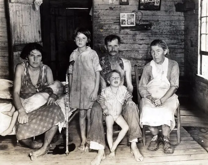 Sharecropper Bud Fields and his family at home. Hale County, Alabama. Published in the book, 'Let Us Now Praise Famous Men'. photograph by Walker Evans,  1936.