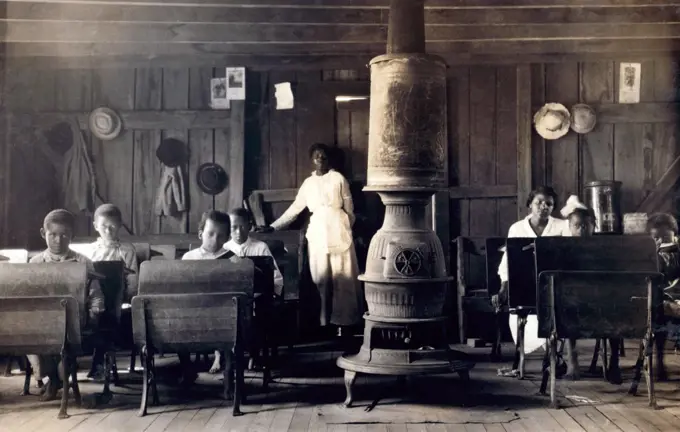 School in session - half of the students are not in school but out picking tobacco. Colored School at Anthoston, Kentucky. Photo by Lewis Wickes Hine, September 13, 1916.