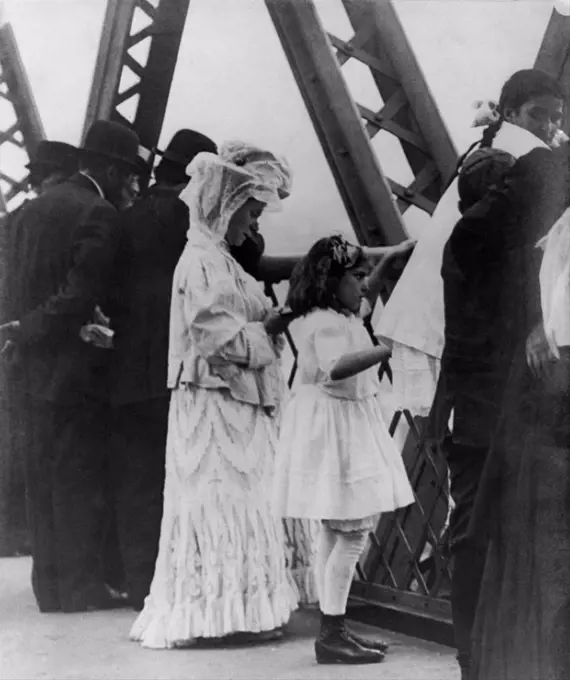 Jews praying on the Williamsburg Bridge on Yom Kippur, the Jewish New Year. Ca. 1909.
